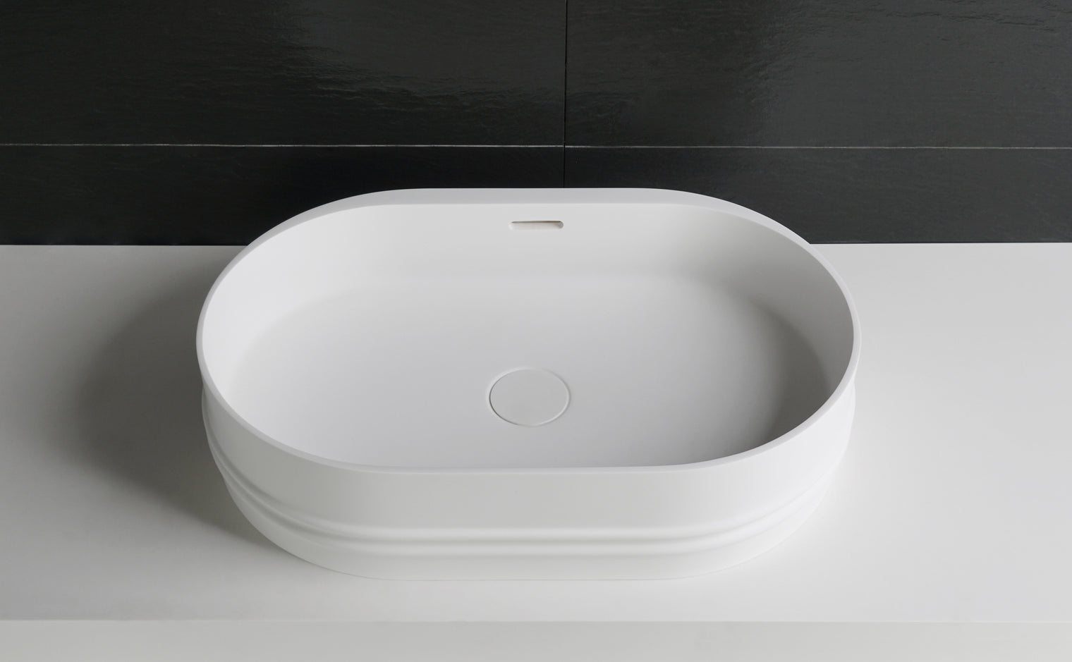 Foggia 55 Designer Solid Surfaces Overcounter Washbasin Foggia系列55CM橢圓型人造石設計師檯上式臉盆採用特別溢水設計